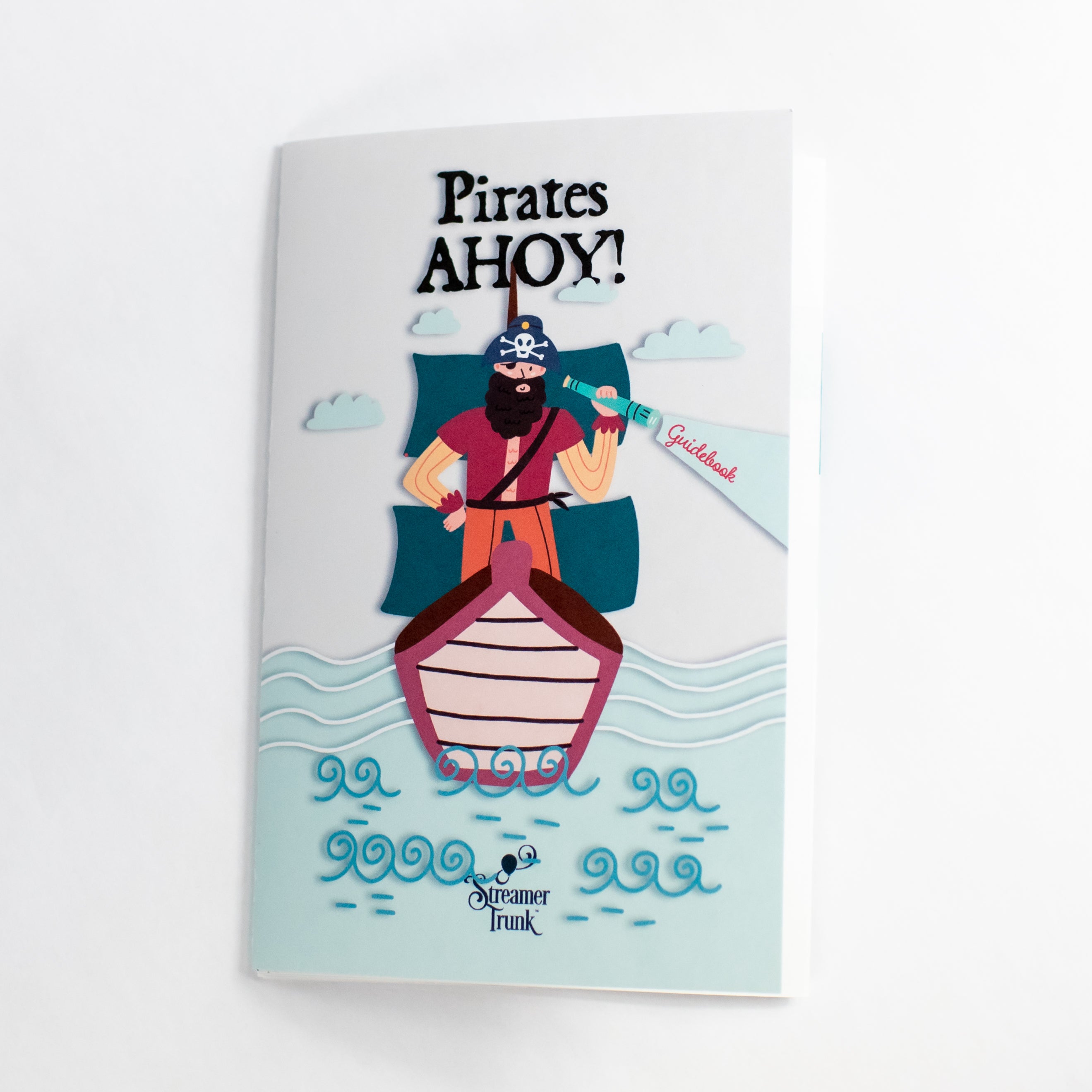 Streamer Trunk guidebook entitled "Pirates Ahoy!" featuring a cartoon pirate on a stylized ocean. 